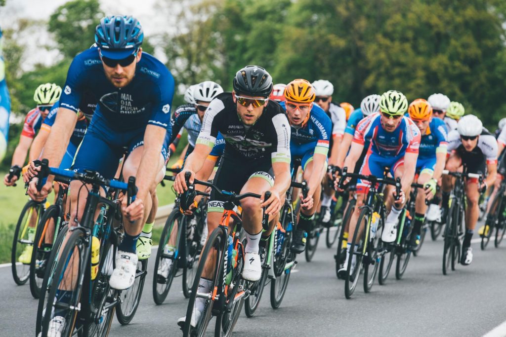 a group of men cycling